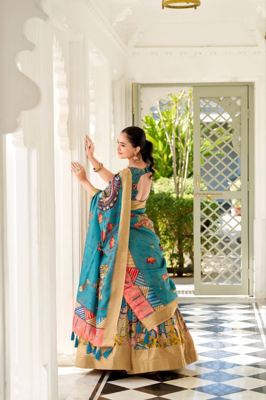 JAMKUDI-Adorned in the elegance of Dola Silk and the intricate charm of Kalamkari prints, the lehenga choli whispers tales of tradition and beauty