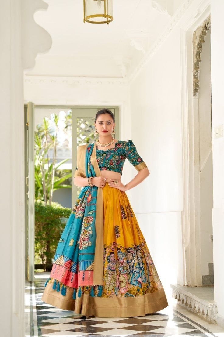 JAMKUDI-Adorned in the elegance of Dola Silk and the intricate charm of Kalamkari prints, the lehenga choli whispers tales of tradition and beauty